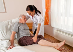 elderly man and a caregiver